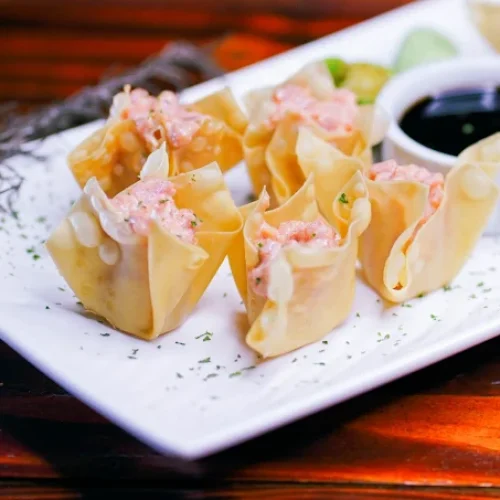 Spicy Tuna Crunch Spicy Tuna Crunch Deep-fried wonton stuffed with spicy tuna. Served with Kikkoman and wasabi.